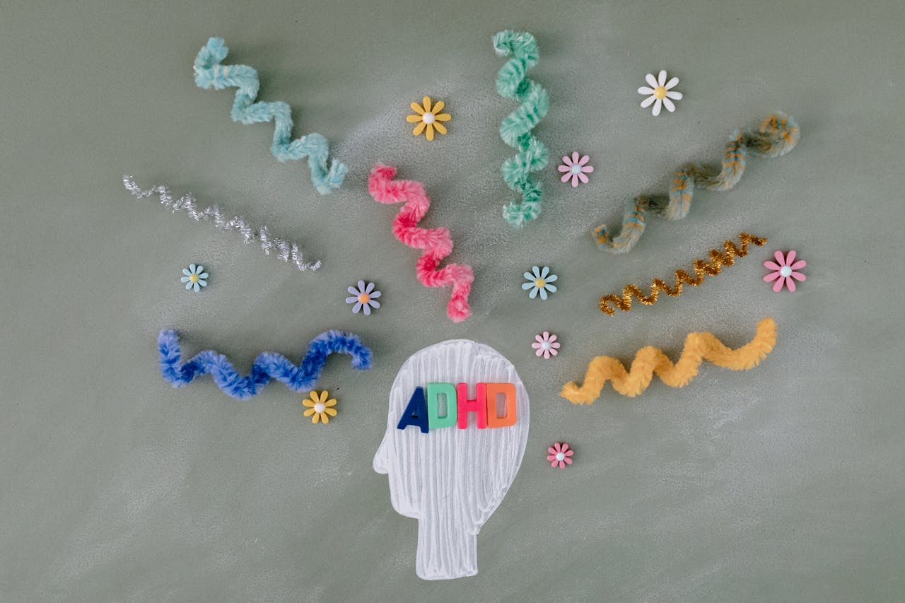 about-us Creative illustration highlighting ADHD awareness with colorful brain imagery.